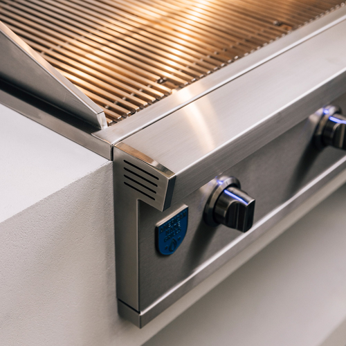 Stainless steel grill with visible brand logo on a white background