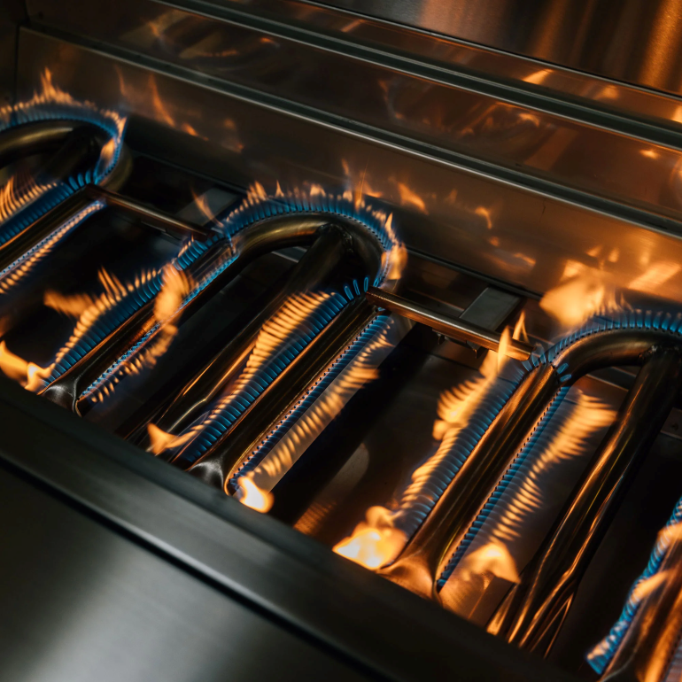 Close-up of gas stove burners with flames