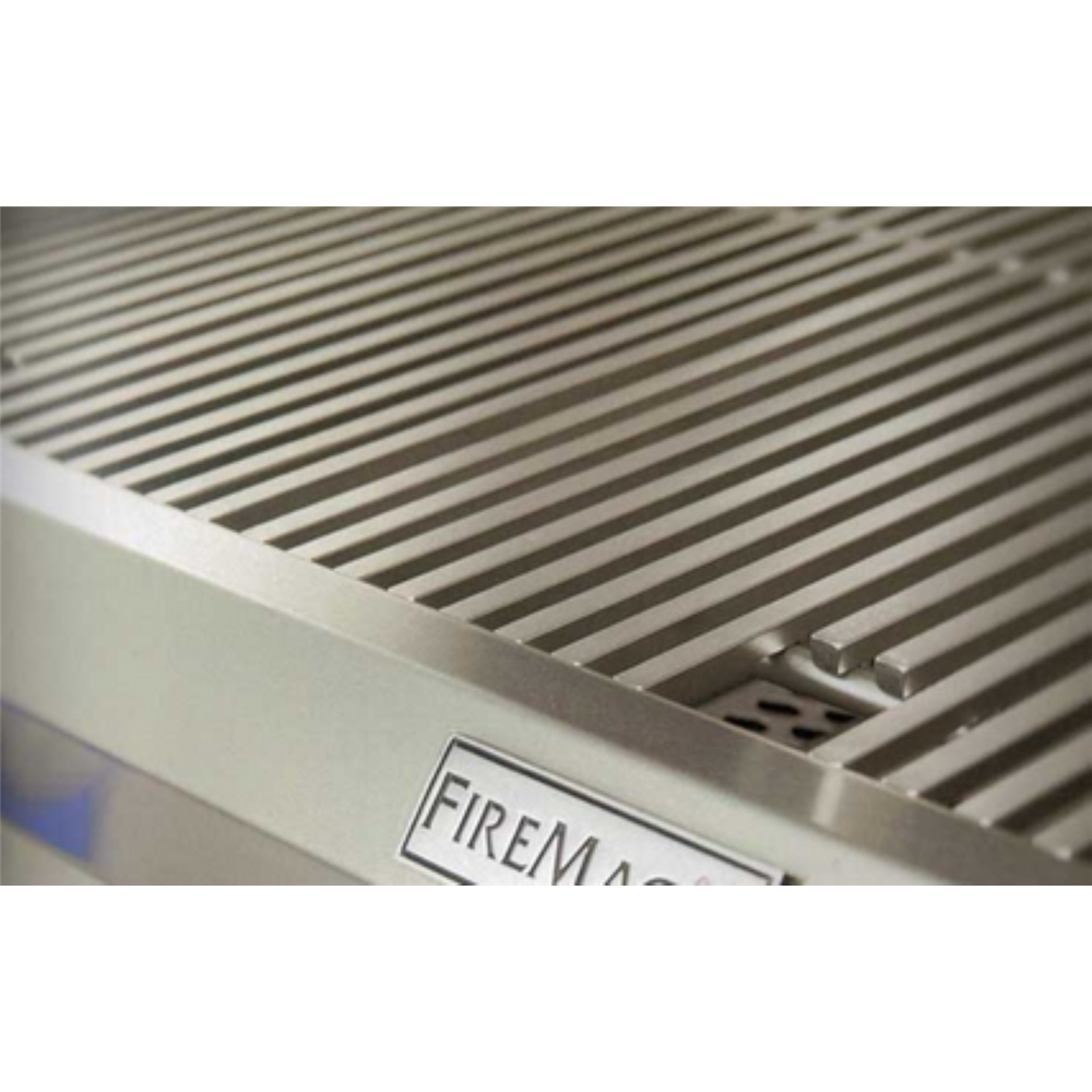 Close-up of a stainless steel grill grate with a visible FIREMADE label on the front edge.