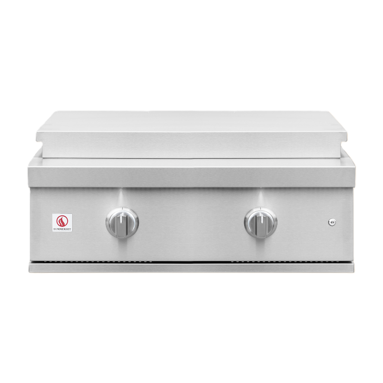 A stainless steel built-in gas grill with a flat griddle top, featuring two control knobs on the front panel and a small red and white logo badge on the left side.