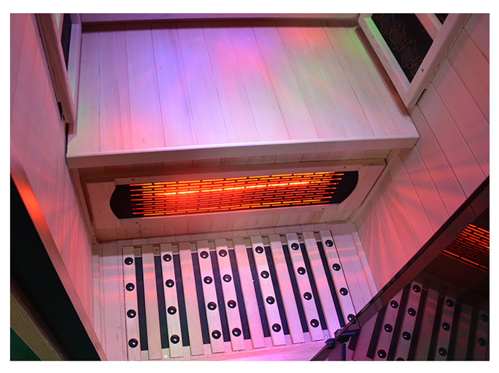 Infrared sauna with wooden interior and glowing heating element.