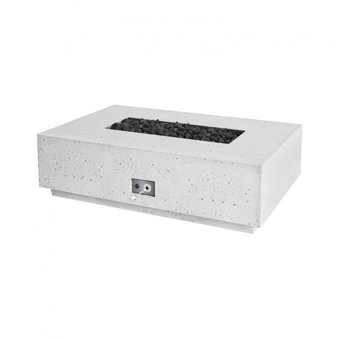 A rectangular concrete fire pit table with a speckled light gray finish, filled with black decorative stones, shown on a solid white background.