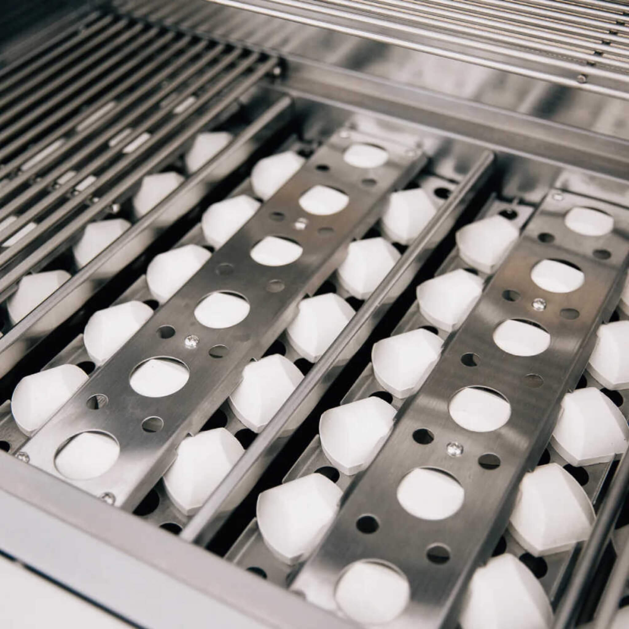 Metallic egg trays with white eggs in a refrigerated setting