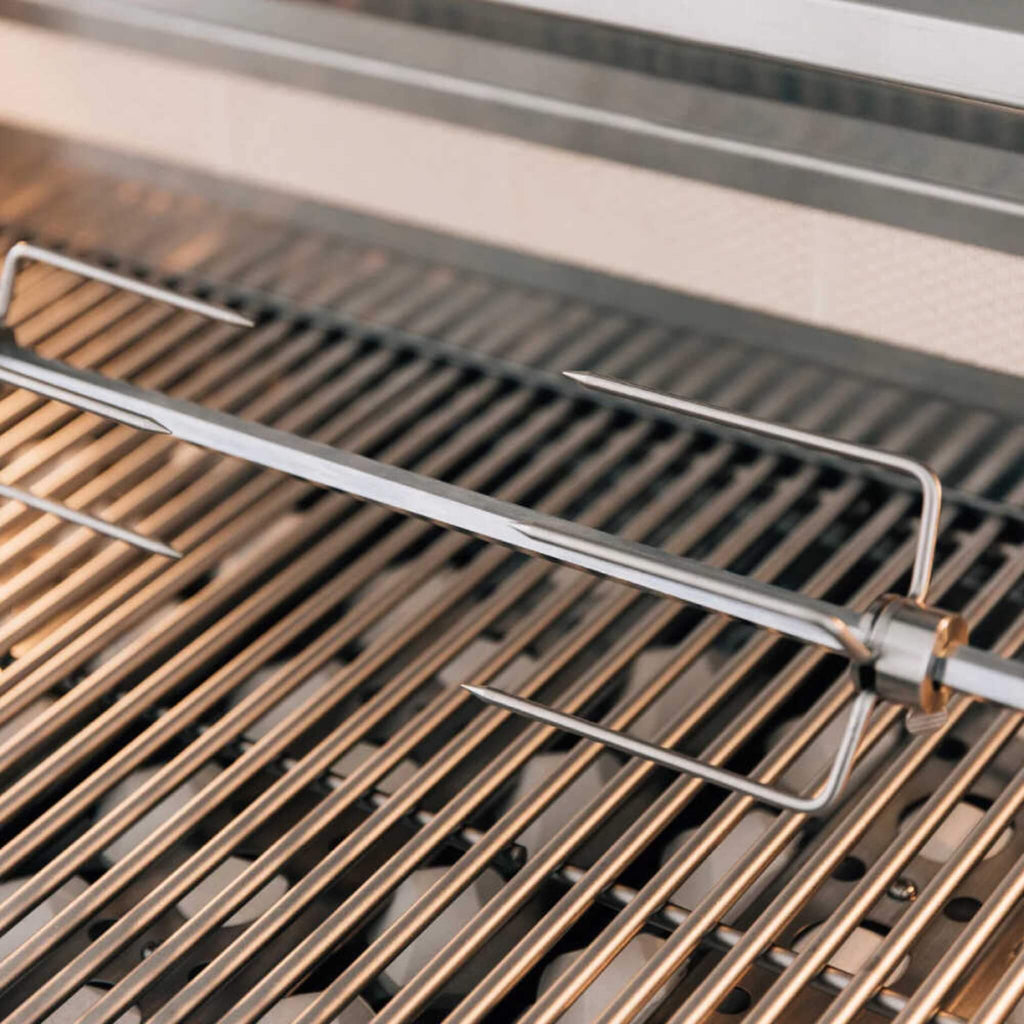 Metal grill brush on a grill grate