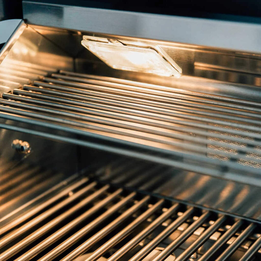 Close-up of a grill with glowing heating elements