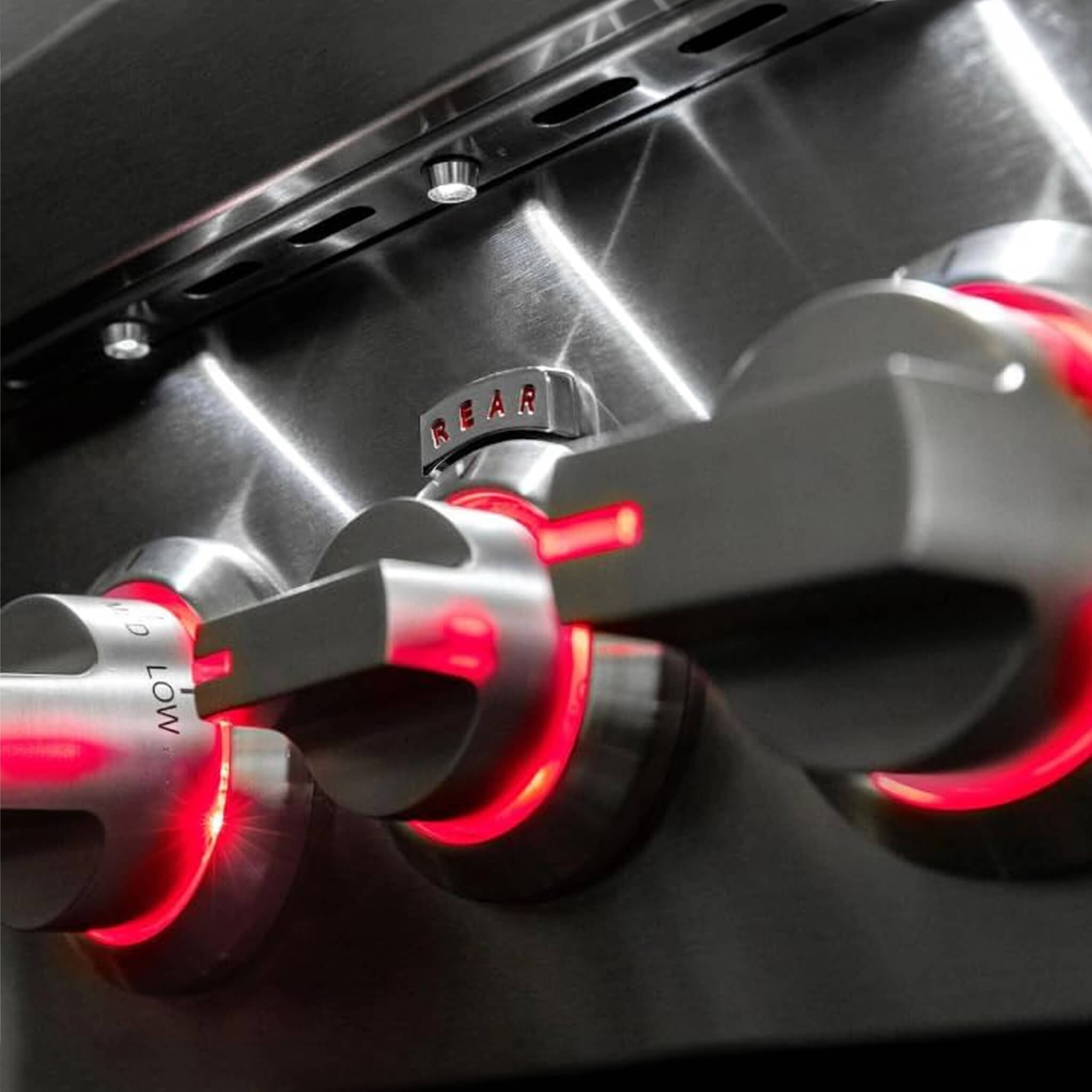 Close-up of a car exhaust system with red glow