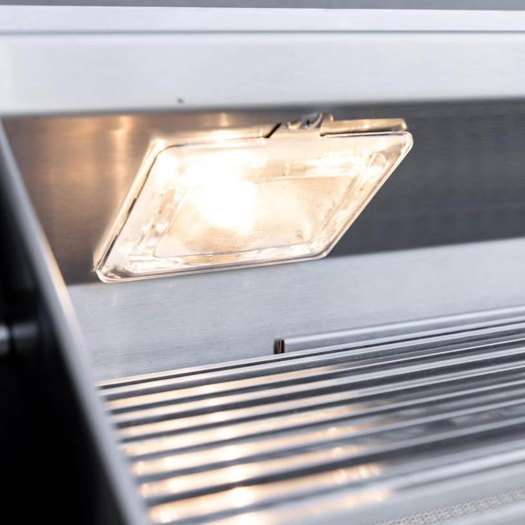 Close-up of a rectangular light fixture on a metallic surface