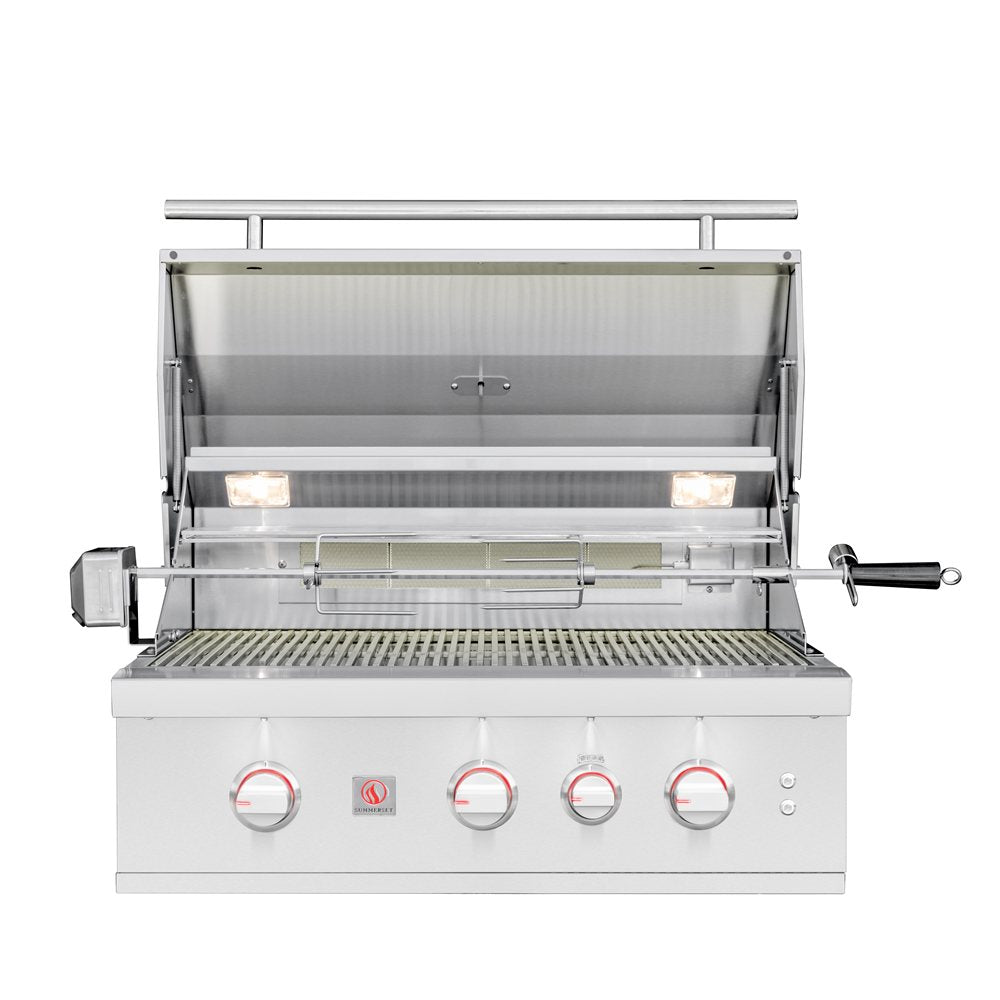 A stainless steel outdoor gas grill with four control knobs, shown open with a rotisserie spit mounted inside. The grill features a white lower cabinet, a stainless steel grates and interior, and a black-handled lid lifter on the right side, set against a plain white background.